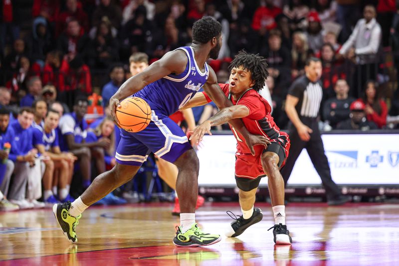 Dec 14, 2024; Piscataway, New Jersey, USA; Seton Hall Pirates guard Zion Harmon (1) looks to steal the ball from Rutgers Scarlet Knights guard Jordan Derkack (0) during the second half at Jersey Mike's Arena. Mandatory Credit: Vincent Carchietta-Imagn Images