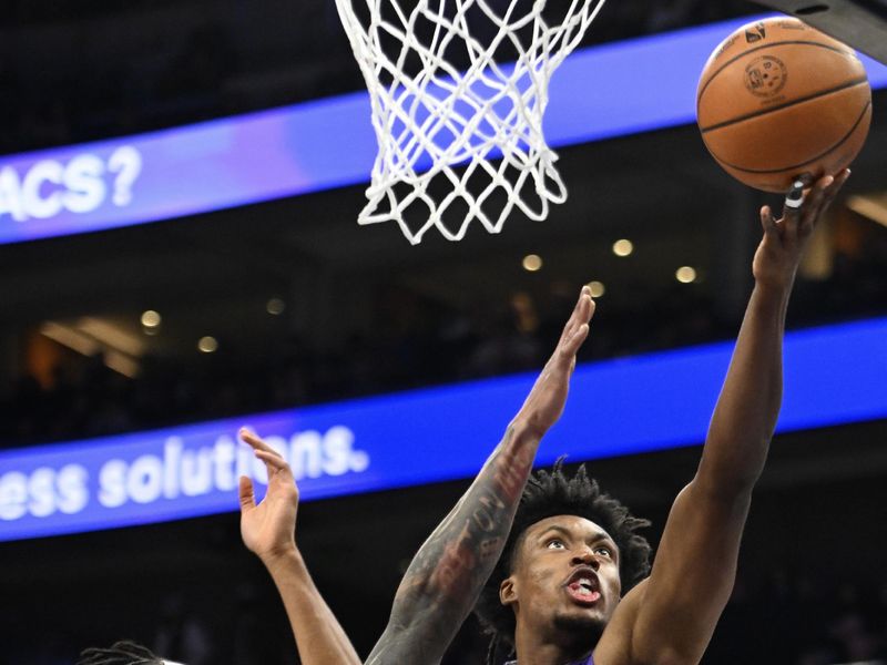 SALT LAKE CITY, UTAH - JANUARY 12: Collin Sexton #2 of the Utah Jazz shoots over Keon Johnson #45 of the Brooklyn Nets during the first half of a game at Delta Center on January 12, 2025 in Salt Lake City, Utah. NOTE TO USER: User expressly acknowledges and agrees that, by downloading and or using this photograph, User is consenting to the terms and conditions of the Getty Images License Agreement.   (Photo by Alex Goodlett/Getty Images)