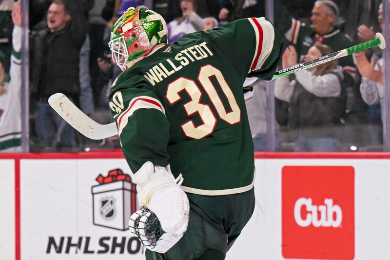Dec 13, 2025; Saint Paul, Minnesota, USA;  Minnesota Wild goalie Jesper Wallstedt (30) celebrates a victory over the Ottawa Senators at Grand Casino Arena. Mandatory Credit: Nick Wosika-Imagn Images