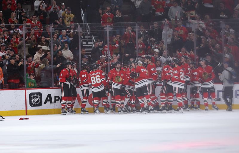 Jan 4, 2026; Chicago, Illinois, USA; The Chicago Blackhawks celebrate a overtime win over the Vegas Golden Knights at United Center. Mandatory Credit: Talia Sprague-Imagn Images