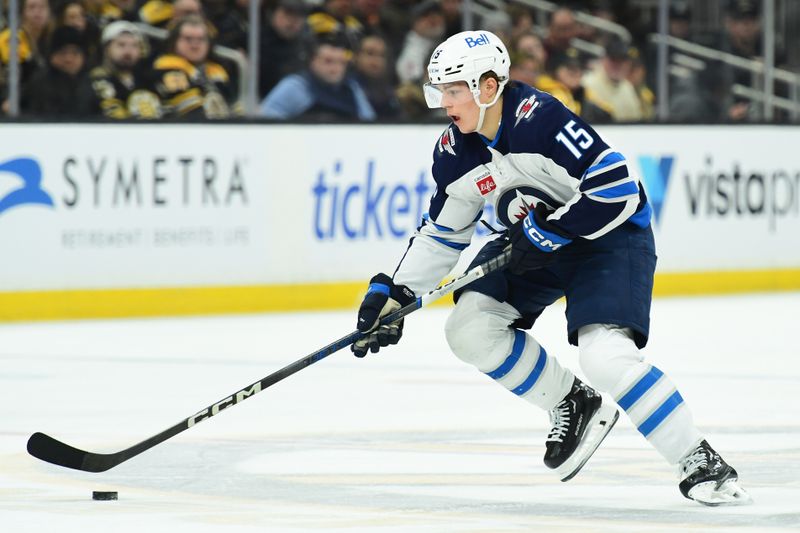 Jan 30, 2025; Boston, Massachusetts, USA; Winnipeg Jets center Rasmus Kupari (15) skates with the puck during the second period against the Boston Bruins at TD Garden. Mandatory Credit: Bob DeChiara-Imagn Images