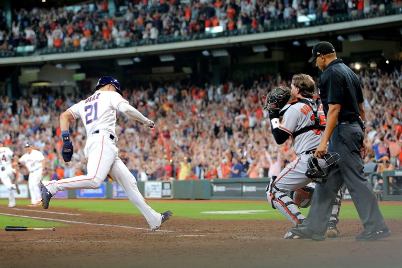 Sep 20, 2023; Houston, Texas, USA; Houston Astros catcher Yainer Diaz (21) crosses home plate to score the winning run against the Baltimore Orioles during the ninth inning at Minute Maid Park. Mandatory Credit: Erik Williams-USA TODAY Sports