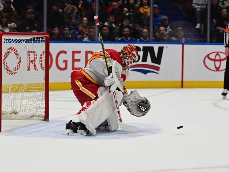 Mar 23, 2024; Vancouver, British Columbia, CAN; Calgary Flames goaltender Jacob Markstrom (25) makes a save againsts the Vancouver Canucks during the first period at Rogers Arena. Mandatory Credit: Simon Fearn-USA TODAY Sports