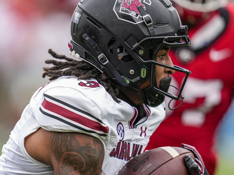 Sep 16, 2023; Athens, Georgia, USA; South Carolina Gamecocks wide receiver Antwane Wells Jr. (3) runs for a touchdown against the Georgia Bulldogs during the first half at Sanford Stadium. Mandatory Credit: Dale Zanine-USA TODAY Sports