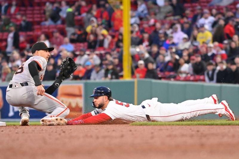 May 1, 2024; Boston, Massachusetts, USA; Boston Red Sox right fielder Wilyer Abreu (52) steals second base  against San Francisco Giants shortstop Nick Ahmed (16) during the second inning at Fenway Park. Mandatory Credit: Eric Canha-USA TODAY Sports