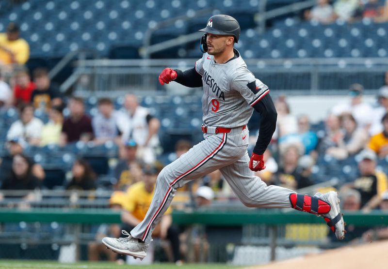 Jun 7, 2024; Pittsburgh, Pennsylvania, USA;  Minnesota Twins left fielder Trevor Larnach (9) runs to second base with a double against the Pittsburgh Pirates during the first inning at PNC Park. Mandatory Credit: Charles LeClaire-USA TODAY Sports