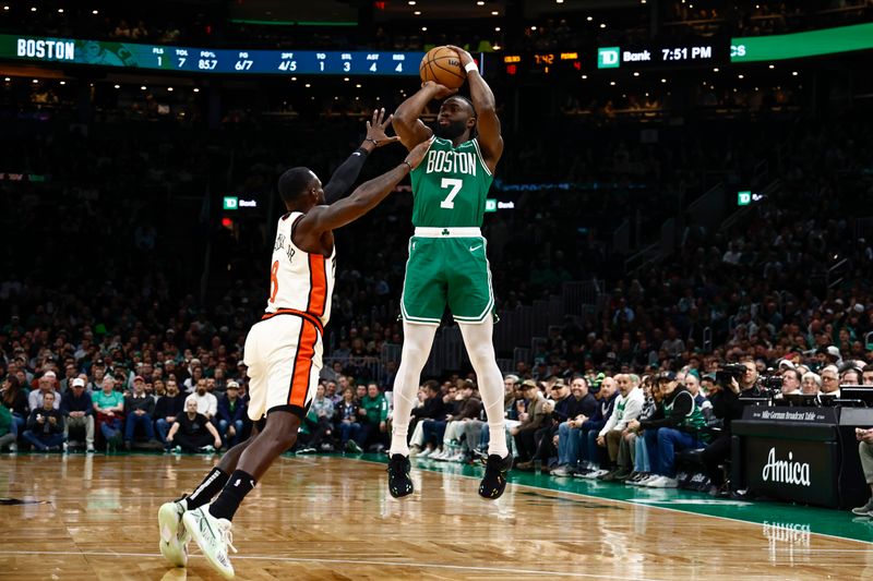 BOSTON, MA - DECEMBER 4: Jaylen Brown #7 of the Boston Celtics shoots over Tim Hardaway Jr. #8 of the Detroit Pistons during the first quarter at TD Garden on December 4, 2024 in Boston, Massachusetts. NOTE TO USER: User expressly acknowledges and agrees that, by downloading and/or using this Photograph, user is consenting to the terms and conditions of the Getty Images License Agreement. (Photo By Winslow Townson/Getty Images)