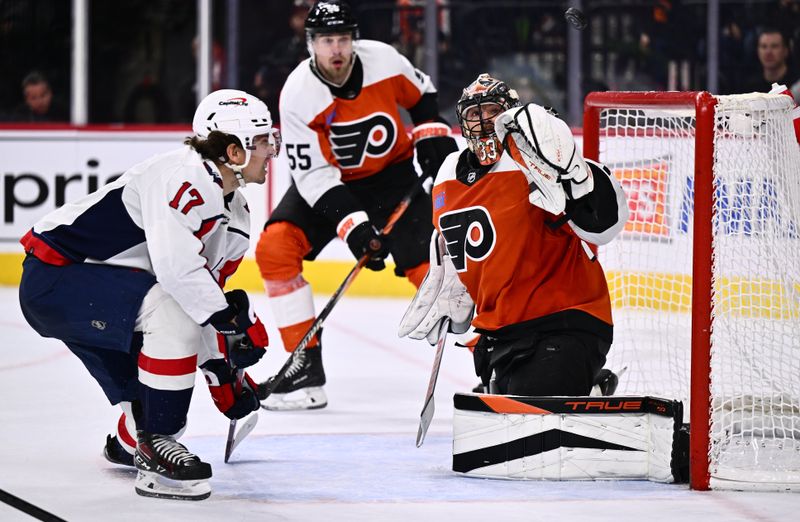 Dec 14, 2023; Philadelphia, Pennsylvania, USA; Philadelphia Flyers goalie Samuel Ersson (33) makes a save as Washington Capitals center Dylan Strome (17) looks on in overtime at Wells Fargo Center. Mandatory Credit: Kyle Ross-USA TODAY Sports