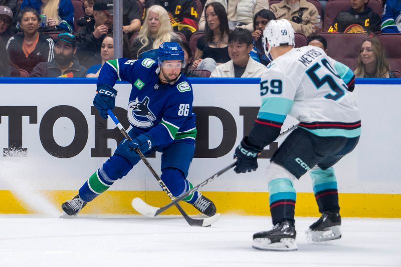 Sep 24, 2024; Vancouver, British Columbia, CAN; Seattle Kraken defenseman Jakub Fibigr (59) defends against Vancouver Canucks defenseman Christian Wolanin (86) during the first period at Rogers Arena. Mandatory Credit: Bob Frid-Imagn Images