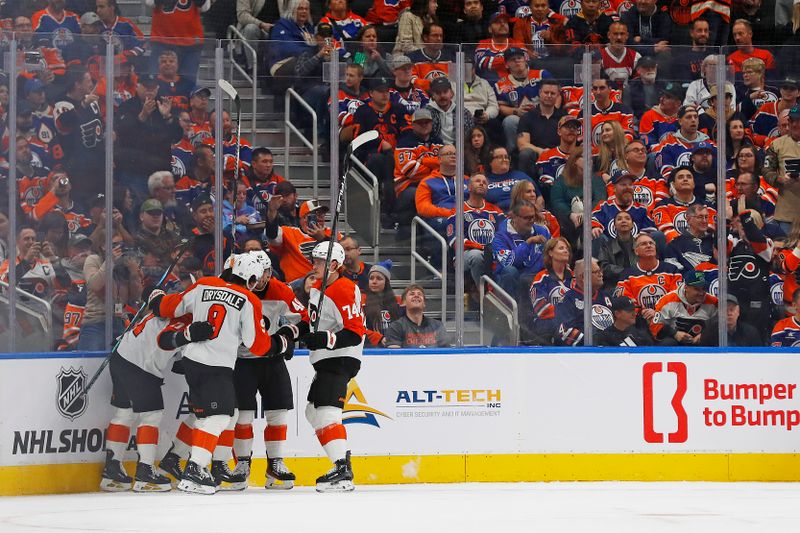 Oct 15, 2024; Edmonton, Alberta, CAN; The celebrate a goal scored by forward Matvei Michkov (39) during the first period against the Edmonton Oilers at Rogers Place. Mandatory Credit: Perry Nelson-Imagn Images