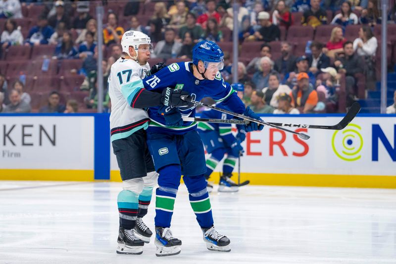 Sep 24, 2024; Vancouver, British Columbia, CAN; Seattle Kraken forward Jaden Schwartz (17) battles for position with Vancouver Canucks defenseman Elias Pettersson (26) during the second period at Rogers Arena. Mandatory Credit: Bob Frid-Imagn Images