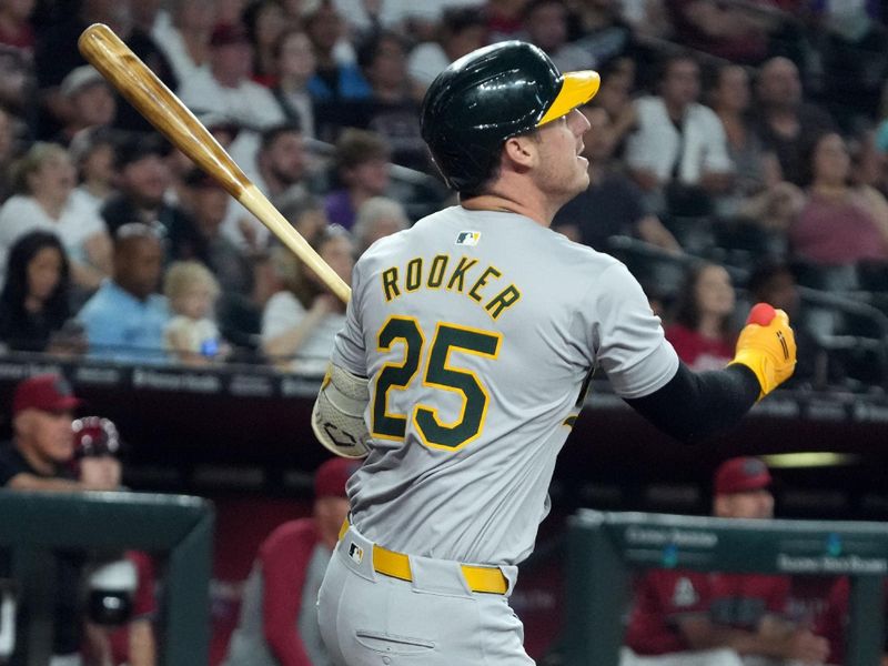 Jun 29, 2024; Phoenix, Arizona, USA; Oakland Athletics outfielder Brent Rooker (25) hits a single against the Arizona Diamondbacks in the first inning at Chase Field. Mandatory Credit: Rick Scuteri-USA TODAY Sports