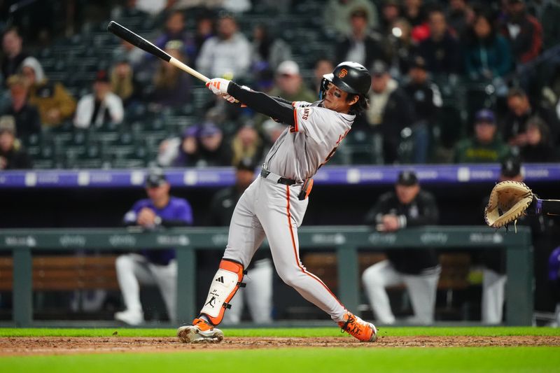 May 8, 2024; Denver, Colorado, USA; San Francisco Giants outfielder Jung Hoo Lee (51) swings the batt in the eighth inning against the Colorado Rockies at Coors Field. Mandatory Credit: Ron Chenoy-USA TODAY Sports