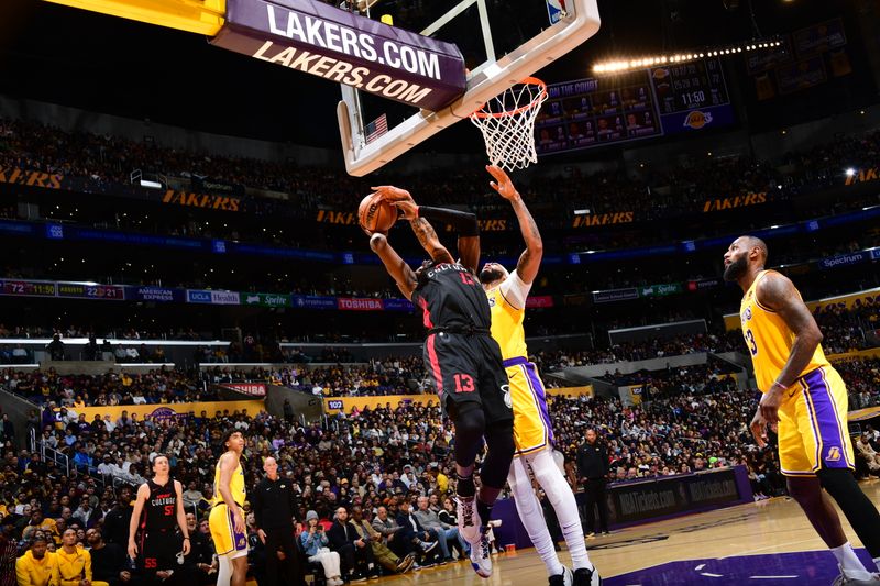 LOS ANGELES, CA - JANUARY 3: Anthony Davis #3 of the Los Angeles Lakers blocks the shot by Bam Adebayo #13 of the Miami Heat during the game on January 3, 2024 at Crypto.Com Arena in Los Angeles, California. NOTE TO USER: User expressly acknowledges and agrees that, by downloading and/or using this Photograph, user is consenting to the terms and conditions of the Getty Images License Agreement. Mandatory Copyright Notice: Copyright 2024 NBAE (Photo by Adam Pantozzi/NBAE via Getty Images)