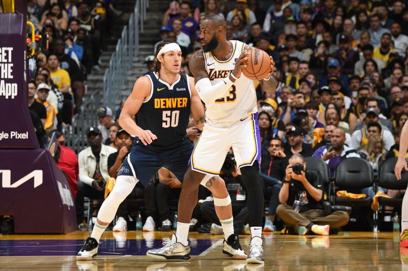 LOS ANGELES, CA - APRIL 27: LeBron James #23 of the Los Angeles Lakers dribbles the ball during the game against the Denver Nuggets during Round 1 Game 4 of the 2024 NBA Playoffs on April 27, 2024 at Crypto.Com Arena in Los Angeles, California. NOTE TO USER: User expressly acknowledges and agrees that, by downloading and/or using this Photograph, user is consenting to the terms and conditions of the Getty Images License Agreement. Mandatory Copyright Notice: Copyright 2024 NBAE (Photo by Andrew D. Bernstein/NBAE via Getty Images)