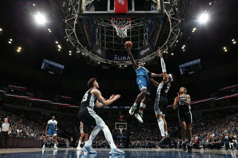 MINNEAPOLIS, MN -  FEBRUARY 27: Anthony Edwards #5 of the Minnesota Timberwolves drives to the basket during the game against the San Antonio Spurs on February 27, 2024 at Target Center in Minneapolis, Minnesota. NOTE TO USER: User expressly acknowledges and agrees that, by downloading and or using this Photograph, user is consenting to the terms and conditions of the Getty Images License Agreement. Mandatory Copyright Notice: Copyright 2024 NBAE (Photo by David Sherman/NBAE via Getty Images)