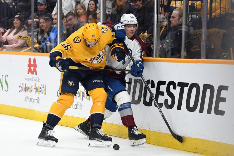 Mar 2, 2024; Nashville, Tennessee, USA; Nashville Predators left wing Cole Smith (36) hits Colorado Avalanche left wing Joel Kiviranta (94) as they play for the puck during the first period at Bridgestone Arena. Mandatory Credit: Christopher Hanewinckel-USA TODAY Sports