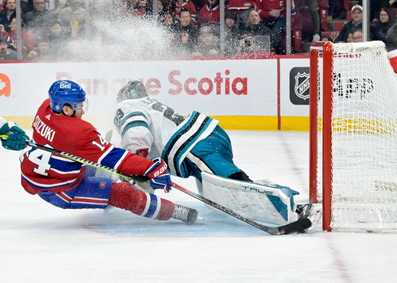 Jan 11, 2024; Montreal, Quebec, CAN; San Jose Sharks goalie Mackenzie Blackwood (29) makes a pad save against Montreal Canadiens forward Nick Suzuki (14) during the third period at the Bell Centre. Mandatory Credit: Eric Bolte-USA TODAY Sports