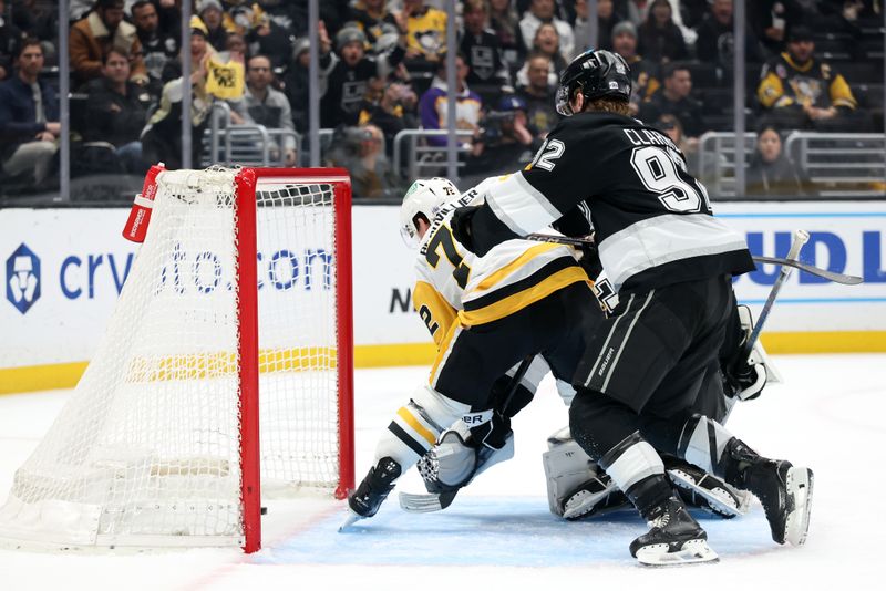 Jan 20, 2025; Los Angeles, California, USA;  Pittsburgh Penguins left wing Anthony Beauvillier (72) scores a goal as Los Angeles Kings defenseman Brandt Clarke (92) defends during the third period at Crypto.com Arena. Mandatory Credit: Kiyoshi Mio-Imagn Images