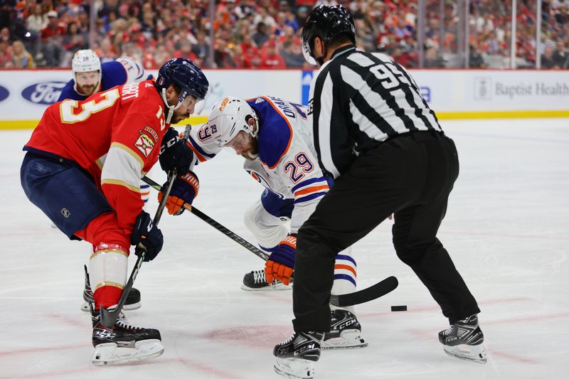 Jun 24, 2024; Sunrise, Florida, USA; Florida Panthers forward Sam Reinhart (13) faces off against Edmonton Oilers forward Leon Draisaitl (29) during the third period in game seven of the 2024 Stanley Cup Final at Amerant Bank Arena. Mandatory Credit: Sam Navarro-USA TODAY Sports