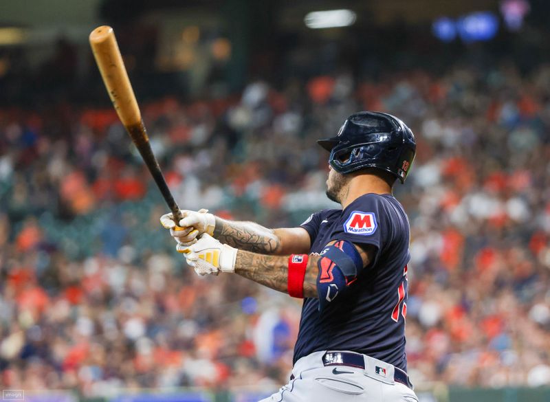 Aug 2, 2023; Houston, Texas, USA; Cleveland Guardians shortstop Gabriel Arias (13) drives in two runs against the Houston Astros in the second inning  at Minute Maid Park. Mandatory Credit: Thomas Shea-USA TODAY Sports