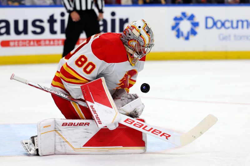 Oct 19, 2023; Buffalo, New York, USA;  Calgary Flames goaltender Dan Vladar (80) makes a save during the second period against the Buffalo Sabres at KeyBank Center. Mandatory Credit: Timothy T. Ludwig-USA TODAY Sports