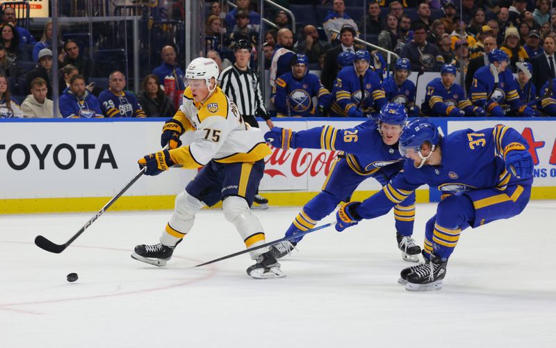 Dec 3, 2023; Buffalo, New York, USA;  Nashville Predators center Juuso Parssinen (75) skates with the puck as Buffalo Sabres defenseman Rasmus Dahlin (26) draw a penalty during the first period at KeyBank Center. Mandatory Credit: Timothy T. Ludwig-USA TODAY Sports