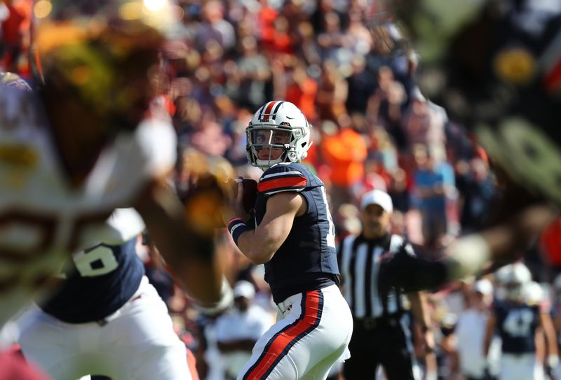 Jan 1, 2020; Tampa, Florida, USA; Auburn Tigers quarterback Bo Nix (10) throws the ball against the Minnesota Golden Gophers during the first quarter at Raymond James Stadium. Mandatory Credit: Kim Klement-USA TODAY Sports