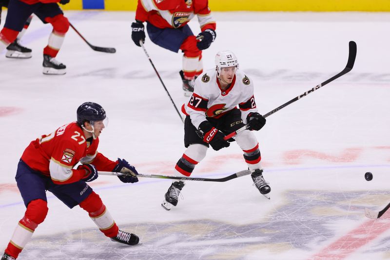 Apr 9, 2024; Sunrise, Florida, USA; Ottawa Senators left wing Parker Kelly (27) moves the puck against the Florida Panthers during the third period at Amerant Bank Arena. Mandatory Credit: Sam Navarro-USA TODAY Sports