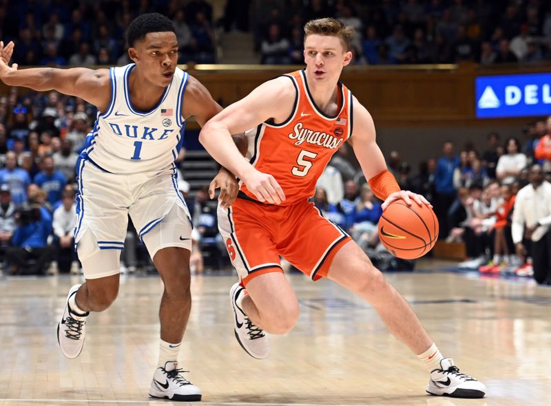 Jan 2, 2024; Durham, North Carolina, USA;  Syracuse Orange guard Justin Taylor (5) drives to the basket as Duke Blue Devils guard Caleb Foster (1) defends during the first half at Cameron Indoor Stadium. Mandatory Credit: Rob Kinnan-USA TODAY Sports