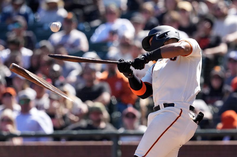 Apr 9, 2023; San Francisco, California, USA; San Francisco Giants left fielder Heliot Ramos (12) breaks his bat during the eighth inning against the Kansas City Royals at Oracle Park. Mandatory Credit: Darren Yamashita-USA TODAY Sports