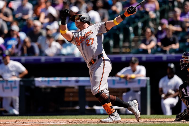 Sep 1, 2024; Denver, Colorado, USA; Baltimore Orioles catcher James McCann (27) watches his ball on a two run home run in the fourth inning against the Colorado Rockies at Coors Field. Mandatory Credit: Isaiah J. Downing-USA TODAY Sports