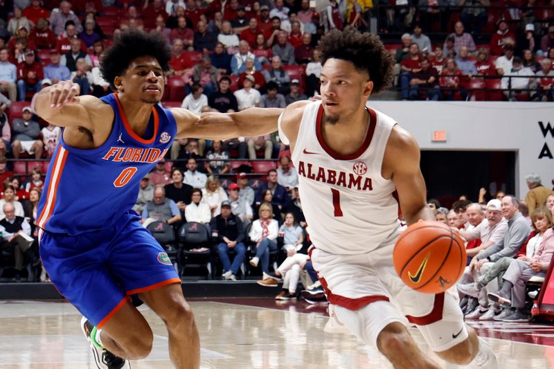 Feb 21, 2024; Tuscaloosa, Alabama, USA; Alabama Crimson Tide guard Mark Sears (1) drives the baseline around Florida Gators guard Zyon Pullin (0) during the first half at Coleman Coliseum. Mandatory Credit: Butch Dill-USA TODAY Sports