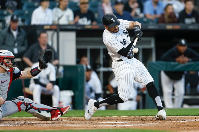 Apr 30, 2024; Chicago, Illinois, USA; Chicago White Sox outfielder Tommy Pham (28) doubles against the Minnesota Twins during the third inning at Guaranteed Rate Field. Mandatory Credit: Kamil Krzaczynski-USA TODAY Sports