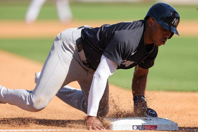 Feb 25, 2024; Clearwater, Florida, USA;  New York Yankees center fielder Greg Allen (31) steals third base against the Philadelphia Phillies in the fifth inning at BayCare Ballpark. Mandatory Credit: Nathan Ray Seebeck-USA TODAY Sports