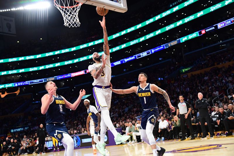 LOS ANGELES, CA - APRIL 27: Anthony Davis #3 of the Los Angeles Lakers drives to the basket during the game against the Denver Nuggets during Round 1 Game 4 of the 2024 NBA Playoffs on April 27, 2024 at Crypto.Com Arena in Los Angeles, California. NOTE TO USER: User expressly acknowledges and agrees that, by downloading and/or using this Photograph, user is consenting to the terms and conditions of the Getty Images License Agreement. Mandatory Copyright Notice: Copyright 2024 NBAE (Photo by Adam Pantozzi/NBAE via Getty Images)