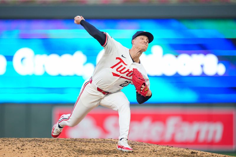 Jun 13, 2024; Minneapolis, Minnesota, USA; Minnesota Twins pitcher Griffin Jax (22) pitches against the Oakland Athletics in the eighth inning at Target Field. Mandatory Credit: Brad Rempel-USA TODAY Sports