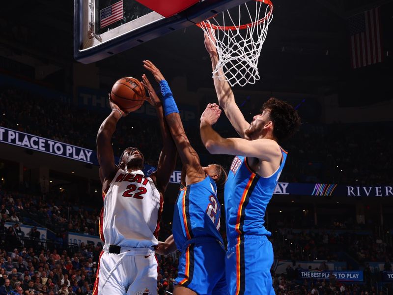 OKLAHOMA CITY, OK - MARCH 8:  Jimmy Butler #22 of the Miami Heat drives to the basket during the game against the Oklahoma City Thunder on March 8, 2024 at Paycom Arena in Oklahoma City, Oklahoma. NOTE TO USER: User expressly acknowledges and agrees that, by downloading and or using this photograph, User is consenting to the terms and conditions of the Getty Images License Agreement. Mandatory Copyright Notice: Copyright 2024 NBAE (Photo by Zach Beeker/NBAE via Getty Images)