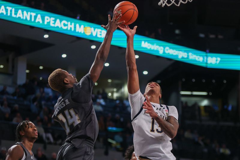 Jan 9, 2024; Atlanta, Georgia, USA; Notre Dame Fighting Irish forward Tae Davis (13) shoots over Georgia Tech Yellow Jackets guard Kowacie Reeves Jr. (14) in the first half at McCamish Pavilion. Mandatory Credit: Brett Davis-USA TODAY Sports