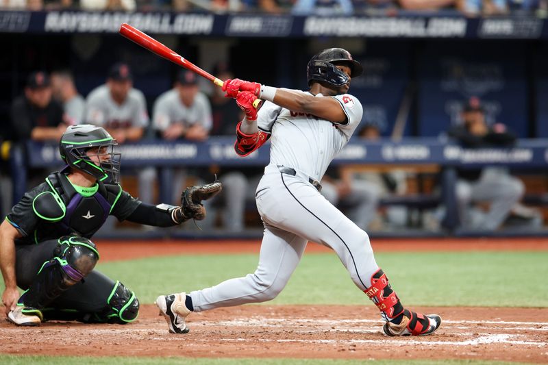 Jul 13, 2024; St. Petersburg, Florida, USA; Cleveland Guardians outfielder Angel Martinez (1) hits a home run against the Tampa Bay Rays in the fifth inning at Tropicana Field. Mandatory Credit: Nathan Ray Seebeck-USA TODAY Sports