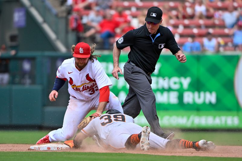 Jun 14, 2023; St. Louis, Missouri, USA;  San Francisco Giants second baseman Thairo Estrada (39) steals second base as St. Louis Cardinals second baseman Brendan Donovan (33) applies the tag during the tenth inning at Busch Stadium. Mandatory Credit: Jeff Curry-USA TODAY Sports