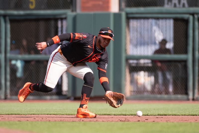 Jul 13, 2024; San Francisco, California, USA; San Francisco Giants second base Thairo Estrada (39) fields a ground ball during the second inning of the game against the Minnesota Twins at Oracle Park. Mandatory Credit: Ed Szczepanski-USA TODAY Sports