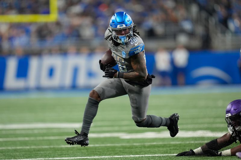 Detroit Lions running back Jahmyr Gibbs (26) runs the ball against the Minnesota Vikings in the second half of an NFL football game in Detroit, Sunday, Jan. 7, 2024. (AP Photo/Paul Sancya)