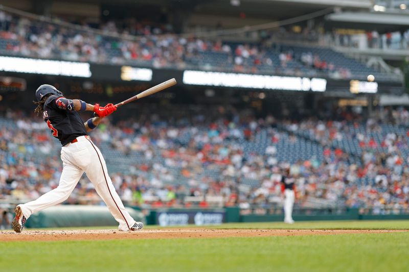 Jun 4, 2024; Washington, District of Columbia, USA; Washington Nationals shortstop CJ Abrams (5) singles against the New York Mets during the third inning at Nationals Park. Mandatory Credit: Geoff Burke-USA TODAY Sports