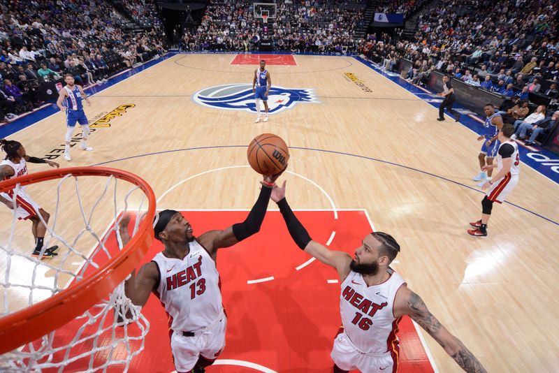 SACRAMENTO, CA - FEBRUARY 26: Bam Adebayo #13 of the Miami Heat grabs a rebound during the game against the Sacramento Kings on February 26, 2024 at Golden 1 Center in Sacramento, California. NOTE TO USER: User expressly acknowledges and agrees that, by downloading and or using this Photograph, user is consenting to the terms and conditions of the Getty Images License Agreement. Mandatory Copyright Notice: Copyright 2024 NBAE (Photo by Rocky Widner/NBAE via Getty Images)