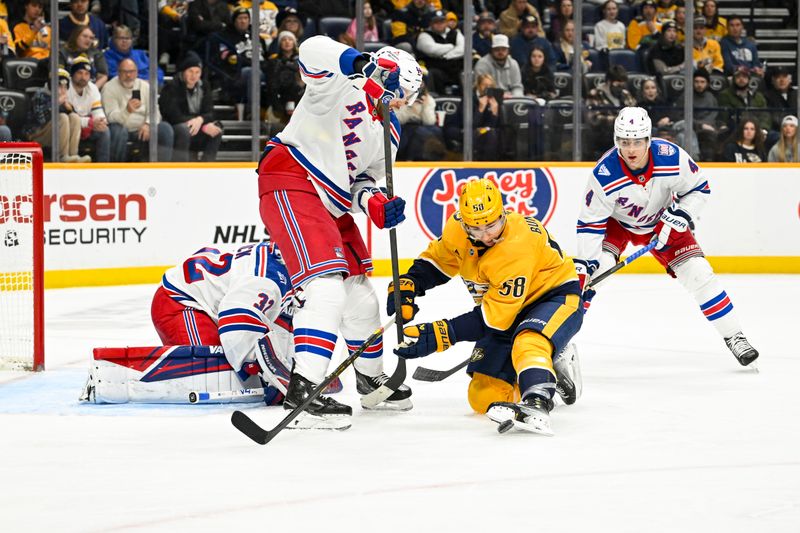 Dec 21, 2025; Nashville, Tennessee, USA;  Nashville Predators left wing Michael Bunting (58) deflects the puck with his skate as New York Rangers defenseman Vladislav Gavrikov (44) defends during the first period at Bridgestone Arena. Mandatory Credit: Steve Roberts-Imagn Images