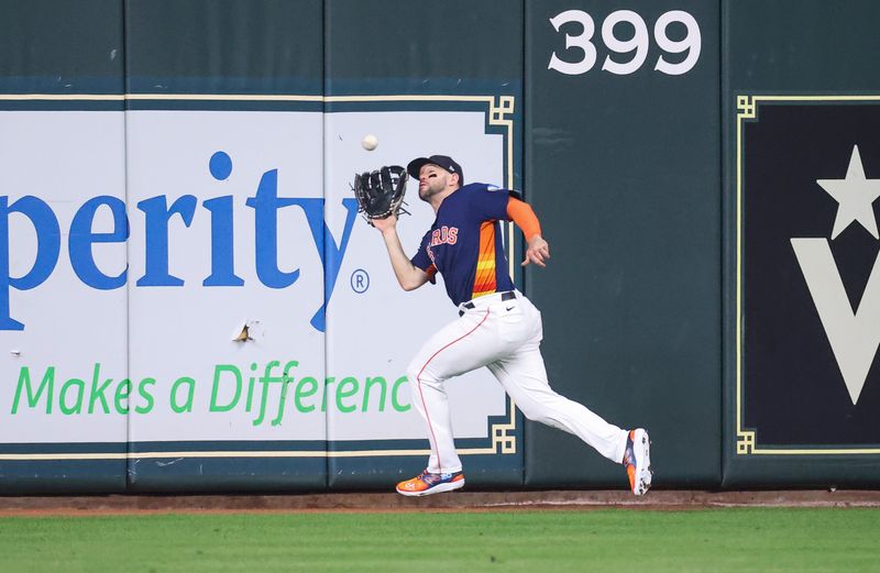 Sep 10, 2023; Houston, Texas, USA; Houston Astros center fielder Chas McCormick (20) makes a running catch of a fly ball during the second inning against the San Diego Padres at Minute Maid Park. Mandatory Credit: Troy Taormina-USA TODAY Sports