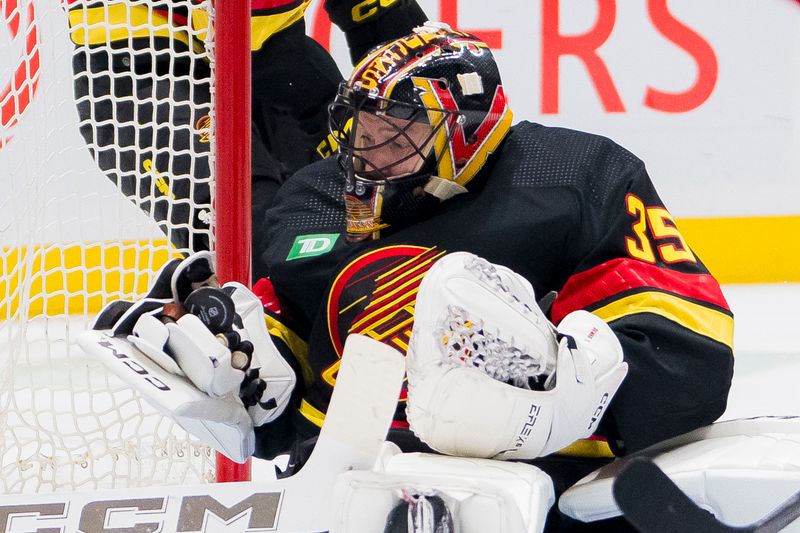 Feb 15, 2024; Vancouver, British Columbia, CAN; Vancouver Canucks goalie Thatcher Demko (35) makes a save against the Detroit Red Wings in the second period at Rogers Arena. Mandatory Credit: Bob Frid-USA TODAY Sports