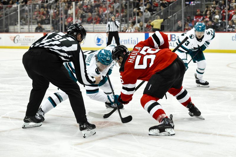 Nov 10, 2024; Newark, New Jersey, USA; San Jose Sharks center Ty Dellandrea (53) faces off against New Jersey Devils left wing Erik Haula (56) during the third period at Prudential Center. Mandatory Credit: John Jones-Imagn Images