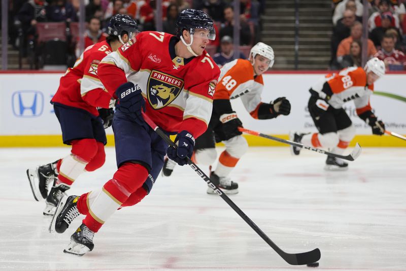 Feb 6, 2024; Sunrise, Florida, USA; Florida Panthers defenseman Niko Mikkola (77) moves the puck against the Philadelphia Flyers during the third period at Amerant Bank Arena. Mandatory Credit: Sam Navarro-USA TODAY Sports